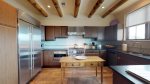 Wood viga ceilings adorn the kitchen